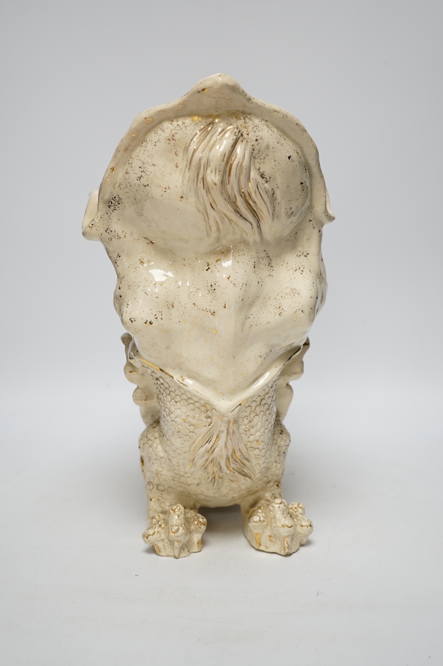An unusual large cream earthenware gilded vase, early 20th century, modelled as a grotesque pottery mythical beast, 32cm high